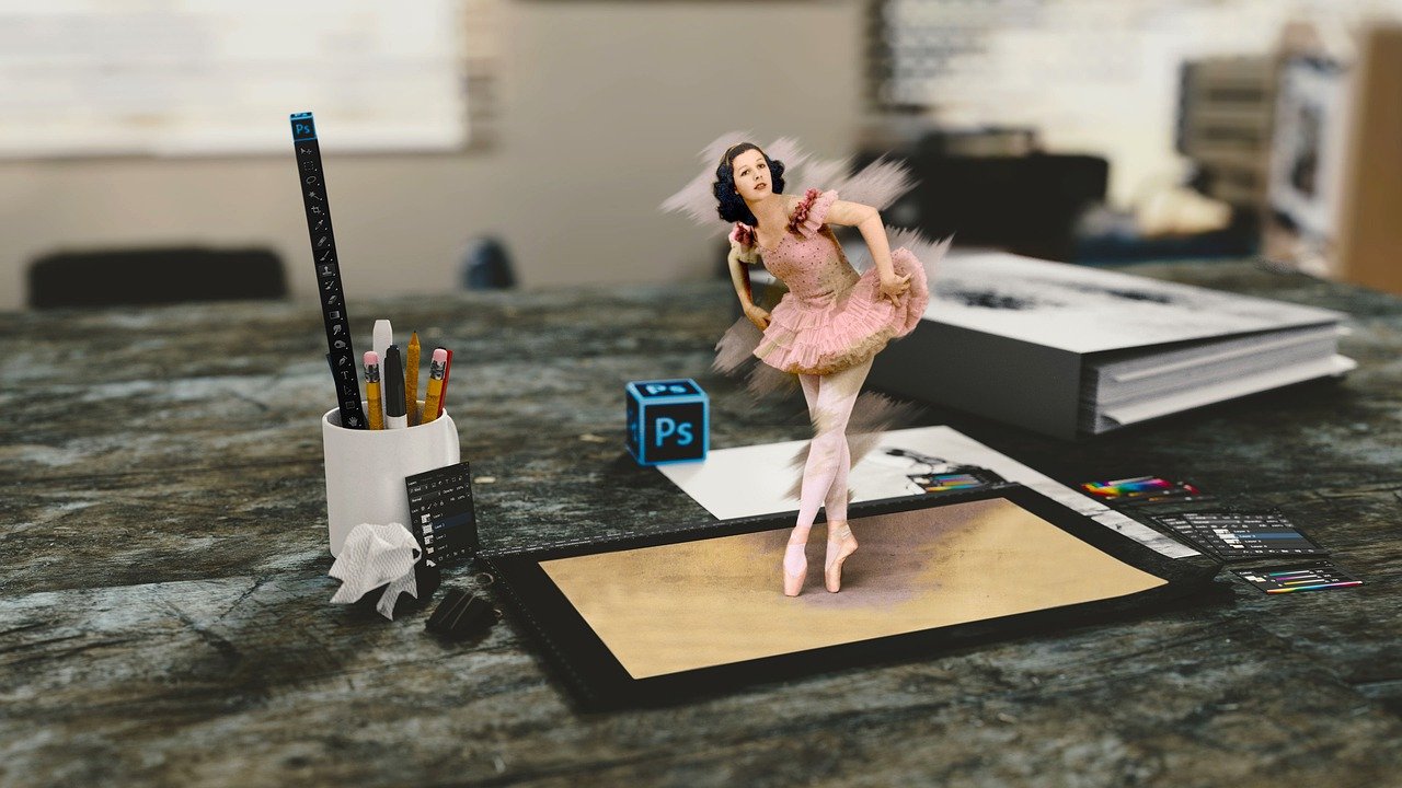 a small ballet dancer figure on a future dance studio business plan document standing  on a desktop