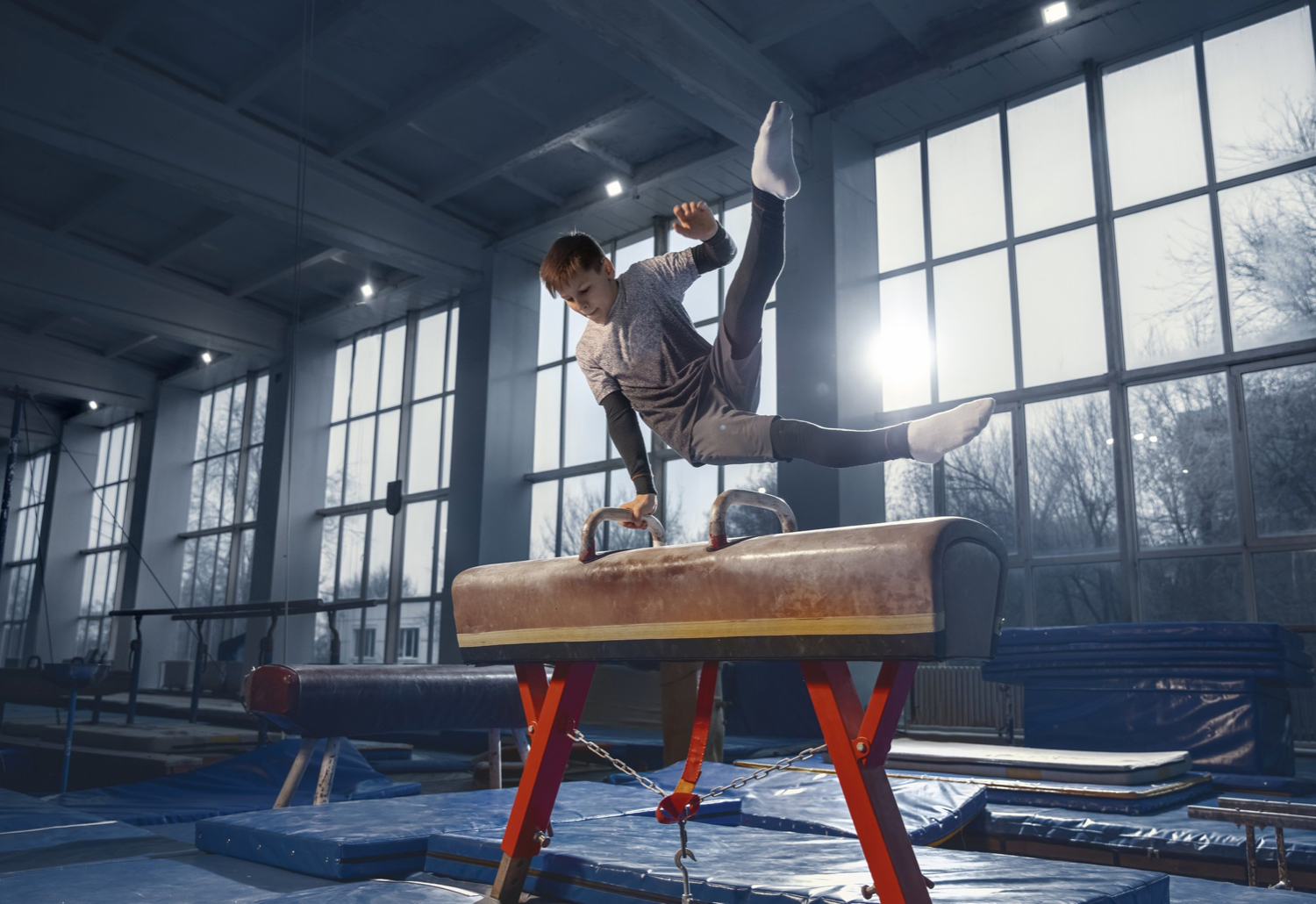 little male gymnast training gym flexible active