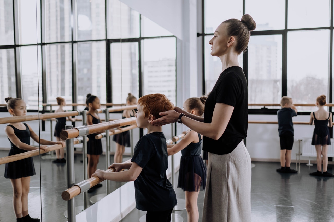 teacher at ballet dance studio after registering a student in the form